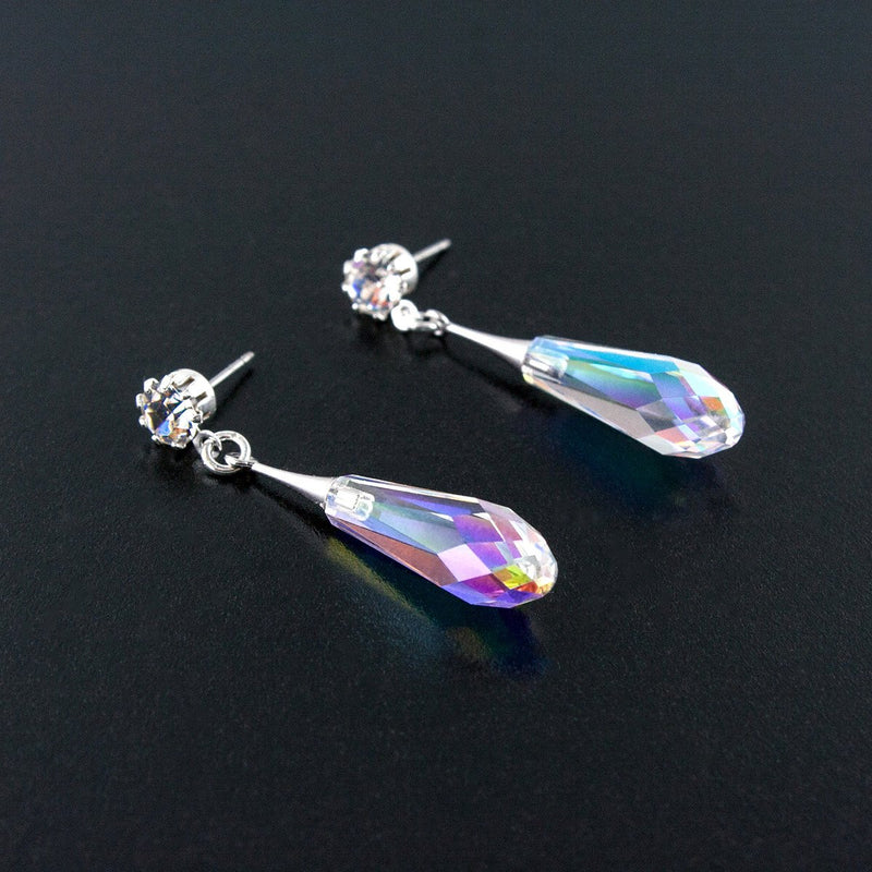 Sleek iridescent crystal drop earrings - flat on surface